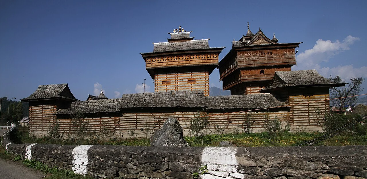 Intricately carved wooden balconies and slate roofs of Bhimakali temple