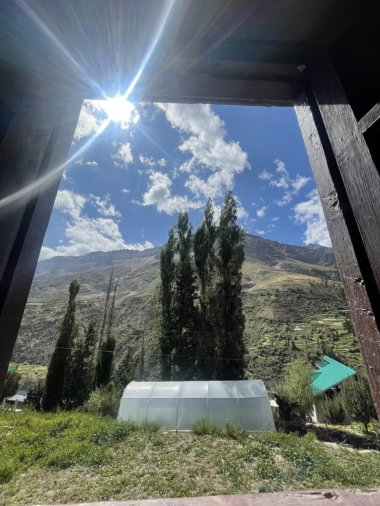 Warm traditional Spiti mud house living with wood-burning heater